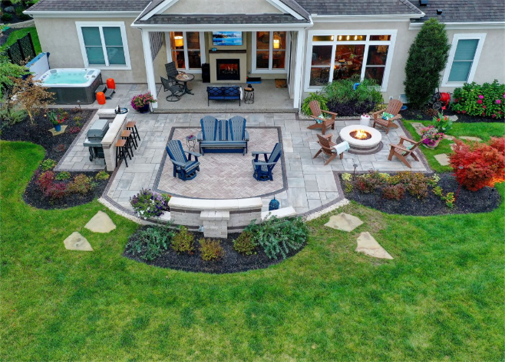 Aerial view of under 1000 sq ft backyard split into grilling bar, seating area, and fire pit gathering zones